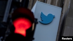 FILE - A view of the Twitter logo at its corporate headquarters in San Francisco, California, Nov. 18, 2022.
