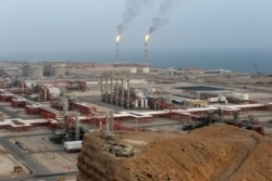 FILE - Natural gas refineries are seen at the South Pars gas field on the northern coast of the Persian Gulf, in Asaluyeh, Iran, March 16, 2019.