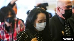 Huawei Technologies Chief Financial Officer Meng Wanzhou enters the B.C. Supreme Court for a hearing in Vancouver, British Columbia, Canada September 24, 2021. REUTERS/Jesse Winter