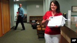 Republican U.S. Senate candidate Leah Vukmir submits nomination papers with Wisconsin elections officials in Madison, Wis., on Wednesday, May 30, 2018. 