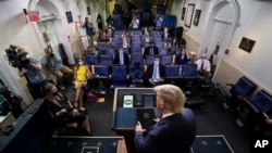 FILE - President Donald Trump arrives to speak during a briefing with reporters in the James Brady Press Briefing Room of the White House, Monday, Aug. 3, 2020, in Washington. (AP Photo/Alex Brandon)