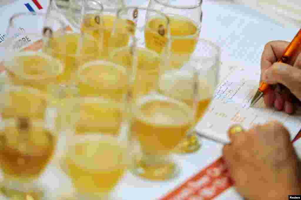 A jury member fills out an evaluation sheet during the Brussels Beer Challenge in Brussels, Belgium.