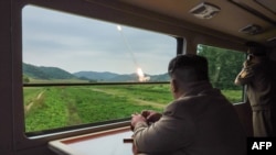 This undated photo released from North Korea's official Korean Central News Agency (KCNA) via KNS on Sept. 13, 2024 shows North Korean leader Kim Jong Un inspecting a test firing of a new-type 600mm multiple rocket launcher at an undisclosed ocation in North Korea.