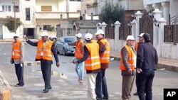 Arab League monitors check Al-Sabil area, in Daraa, Syria, January 3, 2012.