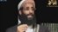 FILE - Anwar al-Awlaki, a U.S.-born cleric linked to al-Qaida's Yemen-based wing, gives a religious lecture in this still image taken from video. A terrorism suspect behind bars for allegedly helping al-Awlaki was indicted for ordering a hit on federal judge.