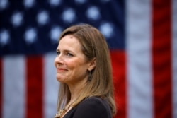 Judge Amy Coney Barrett reacts as President Donald Trump announces her as his nominee to fill a vacant Supreme Court seat, at the White House in Washington, Sept. 26, 2020.