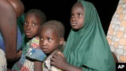 FILE - Children rescued by Nigeria soldiers after being captured by Islamist extremists arrive at a camp in Yola, Nigeria, May 2, 2015. 