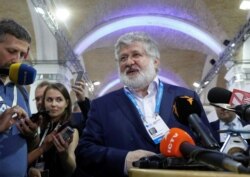 FILE - Ukrainian business tycoon Ihor Kolomoisky speaks with journalists on the sidelines of the Yalta European Strategy annual meeting in Kyiv, Ukraine, Sept. 13, 2019.