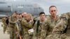 Military personnel from the 82nd Airborne Division and 18th Airborne Corps board a C-17 transport plane for deployment to Eastern Europe, amid escalating tensions between Ukraine and Russia, at Fort Bragg, North Carolina, Feb. 3, 2022. 