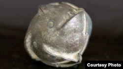 Cluster munitions can release hundreds of bomblets over a wide area. Not all explode after hitting the ground, posing a landmine-like danger. (CMC)