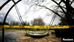 A children's playground is closed with caution tape amid the coronavirus disease (COVID-19) outbreak in Seattle, Washington, U.S., March 24, 2020. (REUTERS/Brian Snyder)