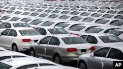 FILE - Volkswagen Jettas produced in Mexico for export are parked at the port terminal in the Gulf city of Veracruz, Mexico. 