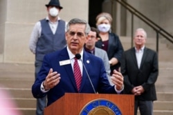 FILE - Georgia Secretary of State Brad Raffensperger speaks during a news conference in Atlanta, Nov. 11, 2020.