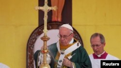 Pope Francis leads a mass at Kyite Ka San Football Stadium in Yangon, Myanmar, Nov. 29, 2017. 