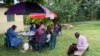 Members of Kirembo village are prepared for the Ebola trial vaccination in Kasese district, Uganda, June 16, 2019. (H. Athumani for VOA)
