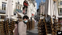 Stacked chairs in front of a cafe in Lille, northern France, Oct. 12, 2020. Lille has been placed under maximum virus alert. 