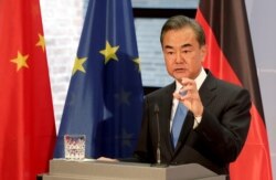 FILE - China's Foreign Minister Wang Yi addresses the media during a visit to Berlin, Germany, Sept. 1, 2020.