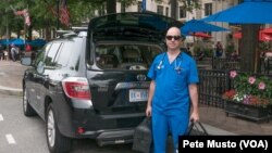 Dr. Ernest Brown works out of his black SUV. (Peter Musto/VOA)