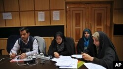 Iranian journalists wait for the announcement of results of parliamentary and Experts Assembly elections at the Interior Ministry, in Tehran, Iran, Feb. 27, 2016. 