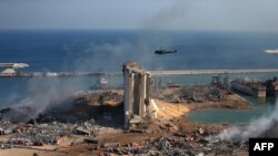 FILE - General view of the damaged grain silos of Beirut's harbor and surroundings on Aug. 5, 2020, one day after a powerful twin explosion tore through Lebanon's capital.(Photo by STR / AFP)