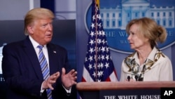 President Donald Trump asks a question to Dr. Deborah Birx, White House coronavirus response coordinator, during a briefing about the coronavirus in the James Brady Briefing Room, March 23, 2020, in Washington. 