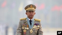 FILE - Myanmar's Commander-in-Chief Senior General Min Aung Hlaing presides an army parade on Armed Forces Day in Naypyitaw, Myanmar, March 27, 2021.