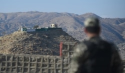 FILE - A Pakistani army soldier stands guard on a border terminal in Ghulam Khan, a town in North Waziristan, on the border between Pakistan and Afghanistan, Jan. 27, 2019.