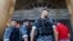 Police officers stand guard outside the building of the Lebanese Association of Banks after anti-government protesters locked the main entrance with a chain during ongoing protests against the banks and the government, in Beirut, Lebanon, Nov. 1, 2019.