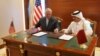 Qatar's foreign minister Sheikh Mohammed bin Abdulrahman al-Thani (R) and U.S. Secretary of State Rex Tillerson sign a memorandum of understanding in Doha, Qatar, July 11, 2017.