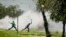 Protesters caught in teargas, hurl stones at police, unseen, during violent clashes in Sasolburg, South Africa, January 22 2013.