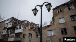 A view shows a residential building damaged by a Russian military strike, amid Russia's attack on Ukraine, in Bakhmut, Ukraine Dec. 18, 2022. 