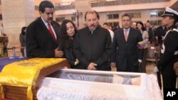 President Daniel Ortega and his wife Rosa Murillo mourn Hugo Chavez.