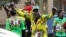 FILE: Supporters of Zimbabwean President Emmerson Mnangagwa celebrate in Harare, Friday, August, 24, 2018. 