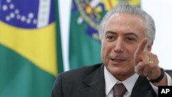 FILE - Brazil President Michel Temer speaks during a meeting with trade unions on the government's proposal for Social Security reform in Brasilia, Brazil, May 16, 2016. Temer sent Donald Trump his congratulations and hopes they can work together. 