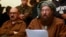 Maulana Sami ul-Haq (R), one of the Taliban negotiators, reads a joint statement with Irfan Siddiqui, a government negotiator, during a news conference in Islamabad, Feb. 6, 2014.