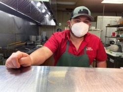 Alejandro Olivares, manager of the Taqueria y Panaderia restaurant, poses for a photo in Lubbock, Texas, March 10, 2021.