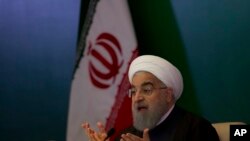 FILE - Iranian President Hassan Rouhani speaks during a meeting with Muslims leaders and scholars in Hyderabad, India, Feb. 15, 2018.