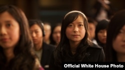 Chinese students listen to President Obama speak during a town hall in China.