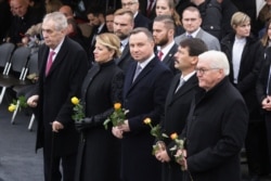 From right, the presidents of Germany Frank-Walter Steinmeier, Hungary Janos Ader, Poland Andrzej Duda, Slovakia Zuzana Caputova and of the Czech Republic Milos Zeman, are seen at Berlin Wall ceremony, in Berlin, Germany, Nov. 9, 2019.
