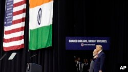 President Donald Trump stands on stage with Indian Prime Minister Narendra Modi at NRG Stadium, Sept. 22, 2019, in Houston, during a "Howdy Modi: Shared Dreams, Bright Futures" event. 