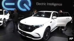 Mercedes Benz displays its first all-electric model in China, the EQC 400 SUV during the Auto Shanghai 2019 show in Shanghai Tuesday, April 16, 2019. (AP Photo/Ng Han Guan)