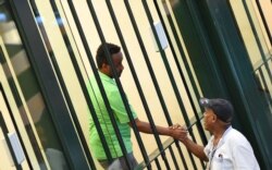 Medhanie Yehdego Mered, who was mistaken for a people-smuggling kingpin but claimed all along he was a victim of mistaken identity, reacts to the verdict in Palermo, Italy, July 12, 2019.