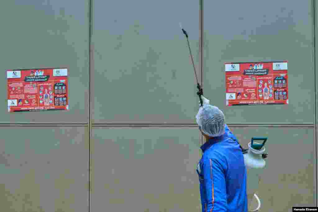 In this March 24, 2020 photo, posters advise the public to wash hands, sanitize and maintain social distancing in the Cairo train station. (VOA/H. Elrasam) 