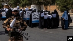 Women march in support of the Taliban government outside Kabul University, Afghanistan, on Saturday, Sept. 11, 2021. (AP Photo/Bernat Armangue)