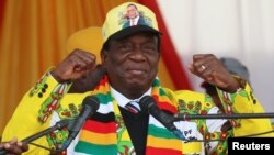 President Emmerson Mnangagwa greets supporters of his ruling ZANU PF party gather for an election rally in Chinhoyi, Zimbabwe, July 17, 2018. 