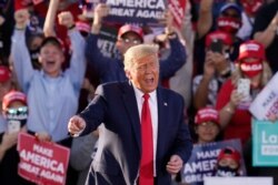 President Donald Trump works the crowd after speaking at a campaign rally, October 19, 2020, in Tucson, Arizona.