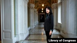 In this June 6, 2019 photo, Joy Harjo, of the United States, poses inside the Library of Congress, in Washington. Harjo has been named the country’s next poet laureate, becoming the first Native American to hold that position. (Shawn Miller/Library of Congress)