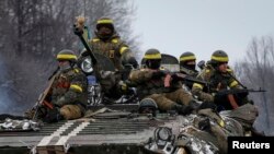 Members of the Ukrainian armed forces in armoured personnel carrier near Debaltseve, eastern Ukraine, Feb. 10, 2015.