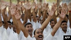 Fear or therapy? Policemen practice laughter therapy in Allahabad, India, in this file photo. 