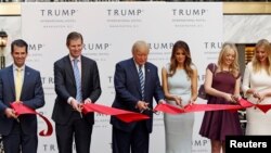 FILE - Donald Trump Jr., Eric Trump, then-Republican U.S. presidential nominee Donald Trump, Melania Trump, Tiffany Trump and Ivanka Trump attend an official ribbon cutting ceremony at the new Trump International Hotel in Washington, Oct. 26, 2016.
